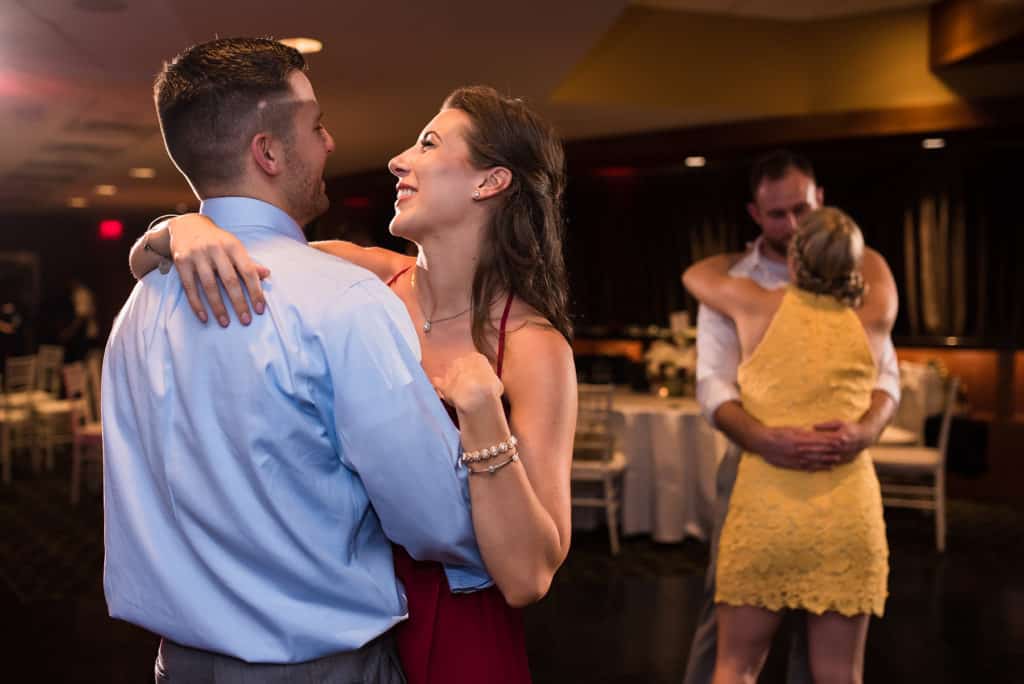 a man and a woman dancing on a dance floor.