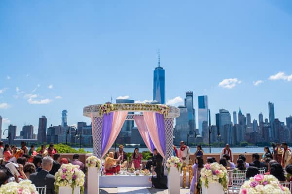 a wedding ceremony in front of a city skyline.
