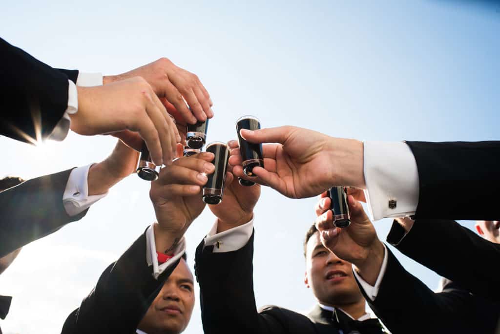 a group of men in suits and ties holding cell phones.