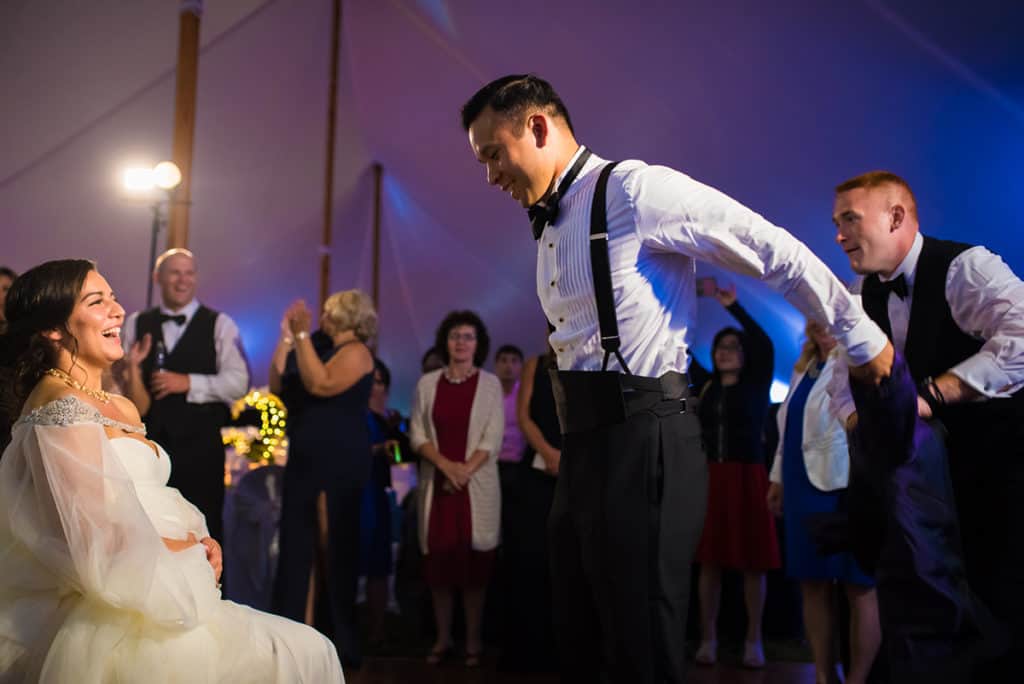 a bride and groom dancing at their wedding reception.