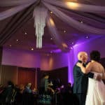 a bride and groom sharing their first dance.