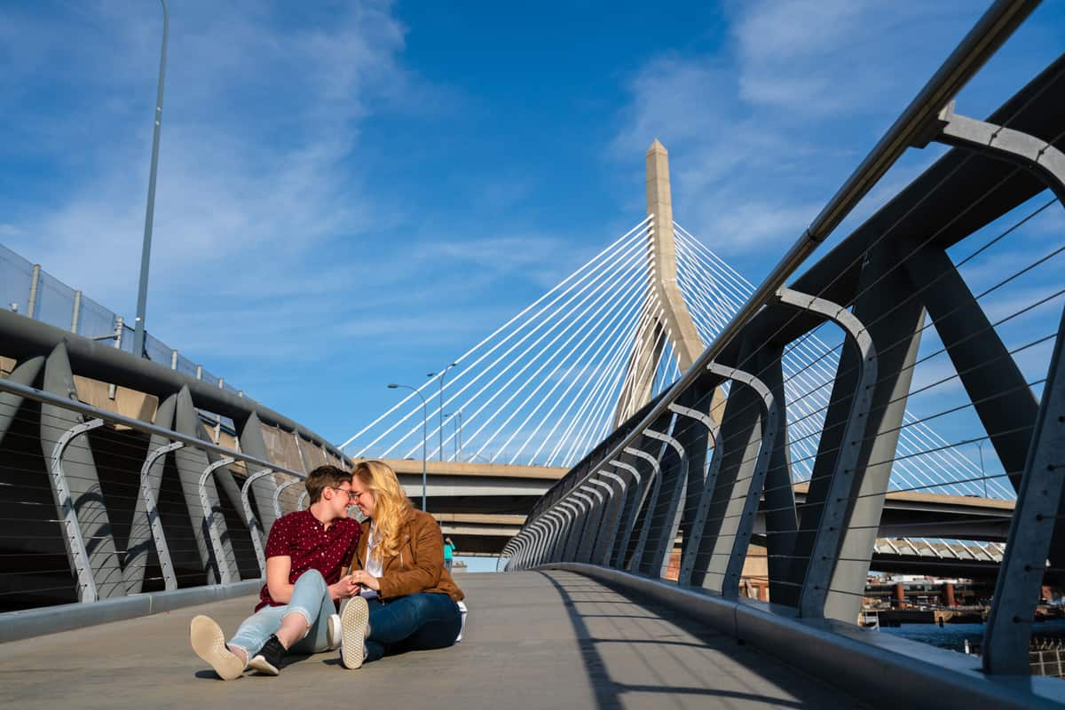 couple posing for engagement session photos in north point park in cambridge by nicole chan photography