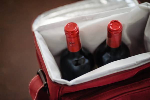 two bottles of wine are in a bag.