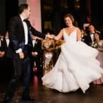 a bride and groom dancing at their wedding reception.