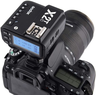 a close up of a camera with a digital camera attached to it.