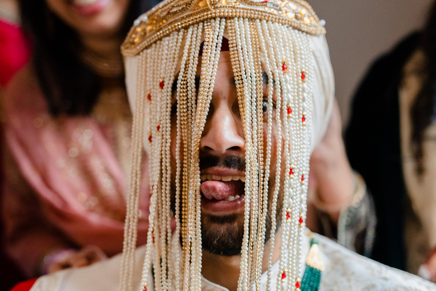 a close up of a person with beads on their head.
