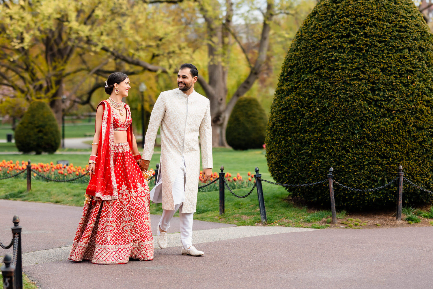 a man and a woman dressed in indian attire.