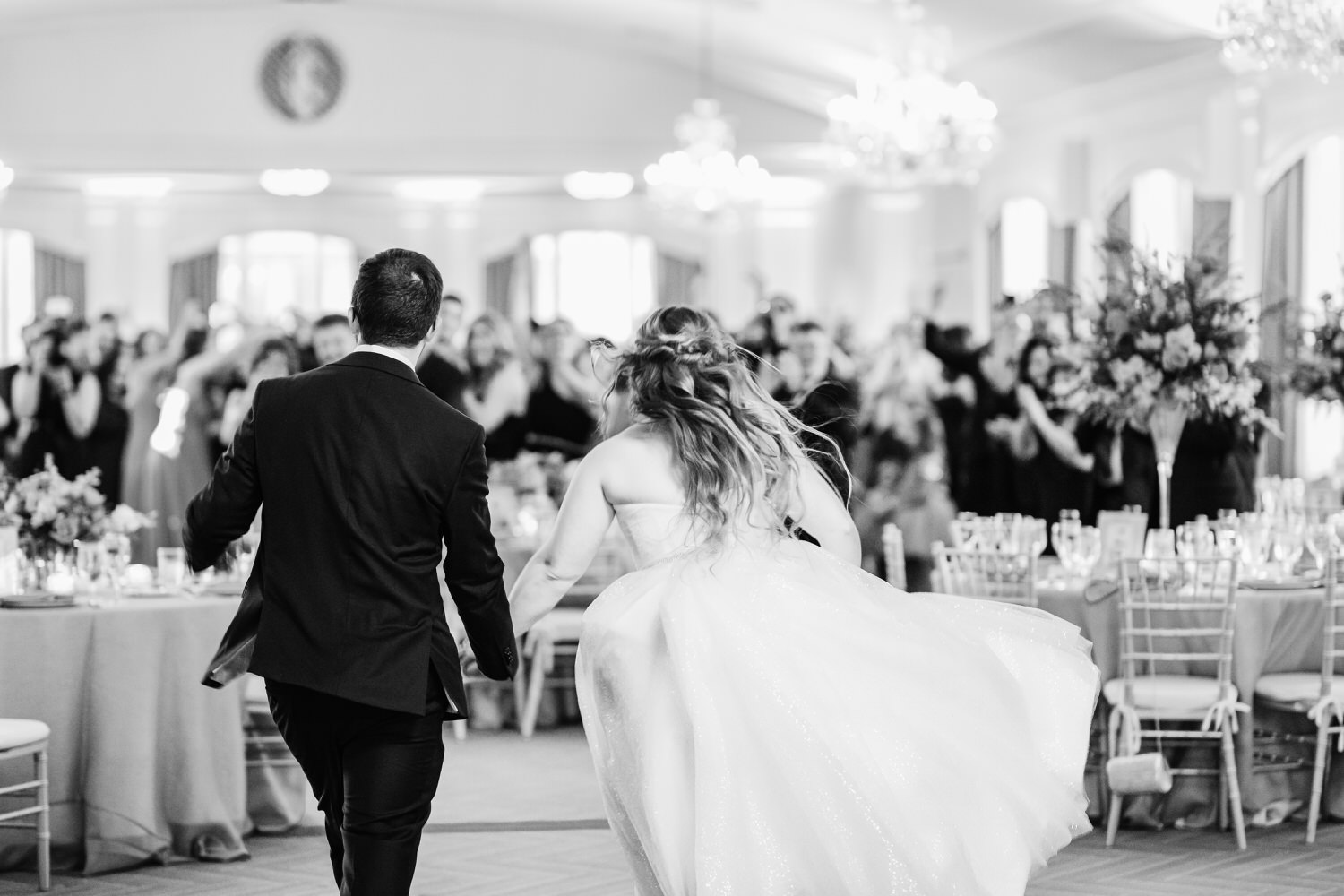 a man and woman running down a aisle.