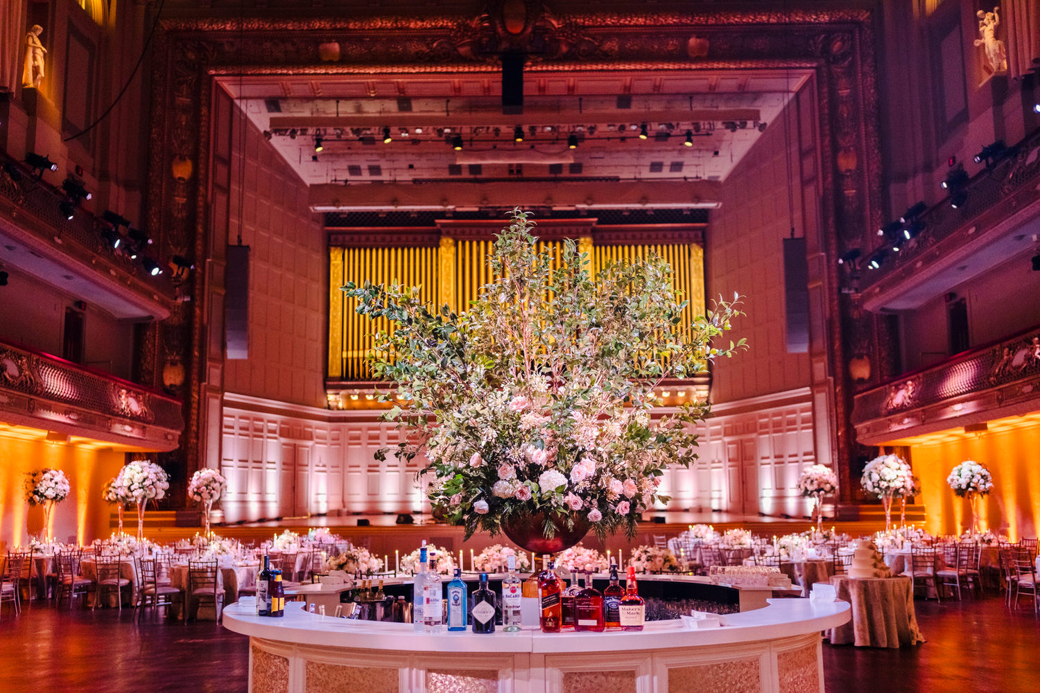 A wedding reception in a large ballroom.