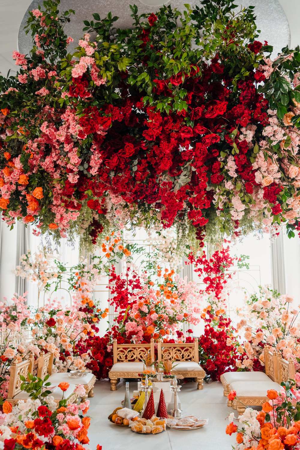 A room filled with flowers hanging from the ceiling.