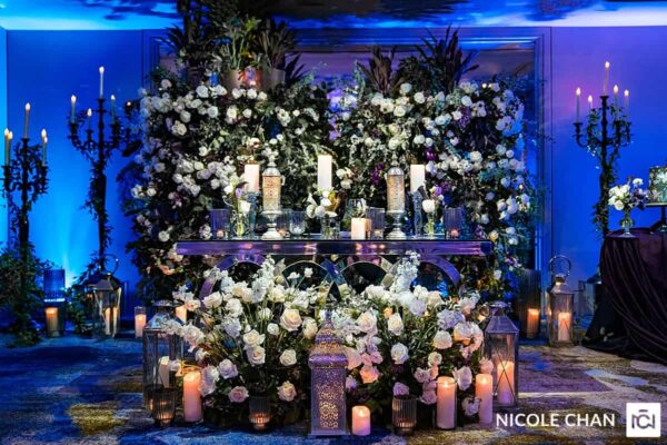 A room decorated with candles and flowers.